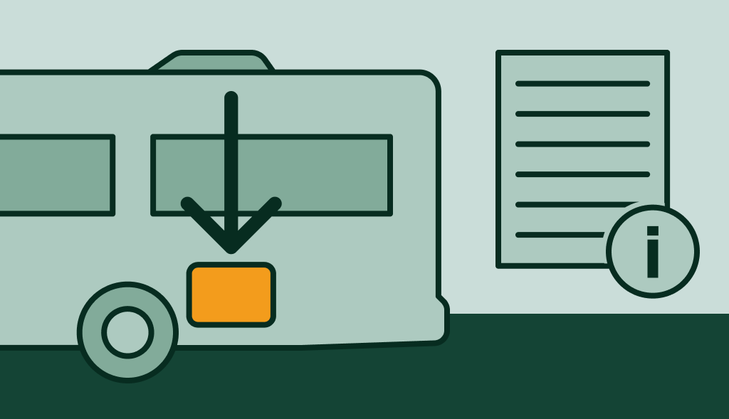 RV with arrow pointing to water heater compartment beside info sheet, showing where the heater is located.