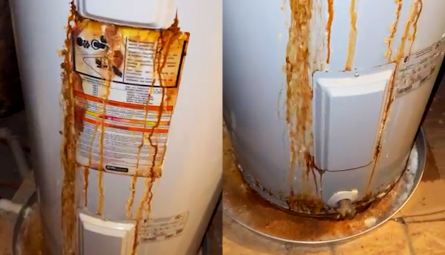Corroded water heater with rusty leaks running down the tank, showing severe water damage and inefficiency.